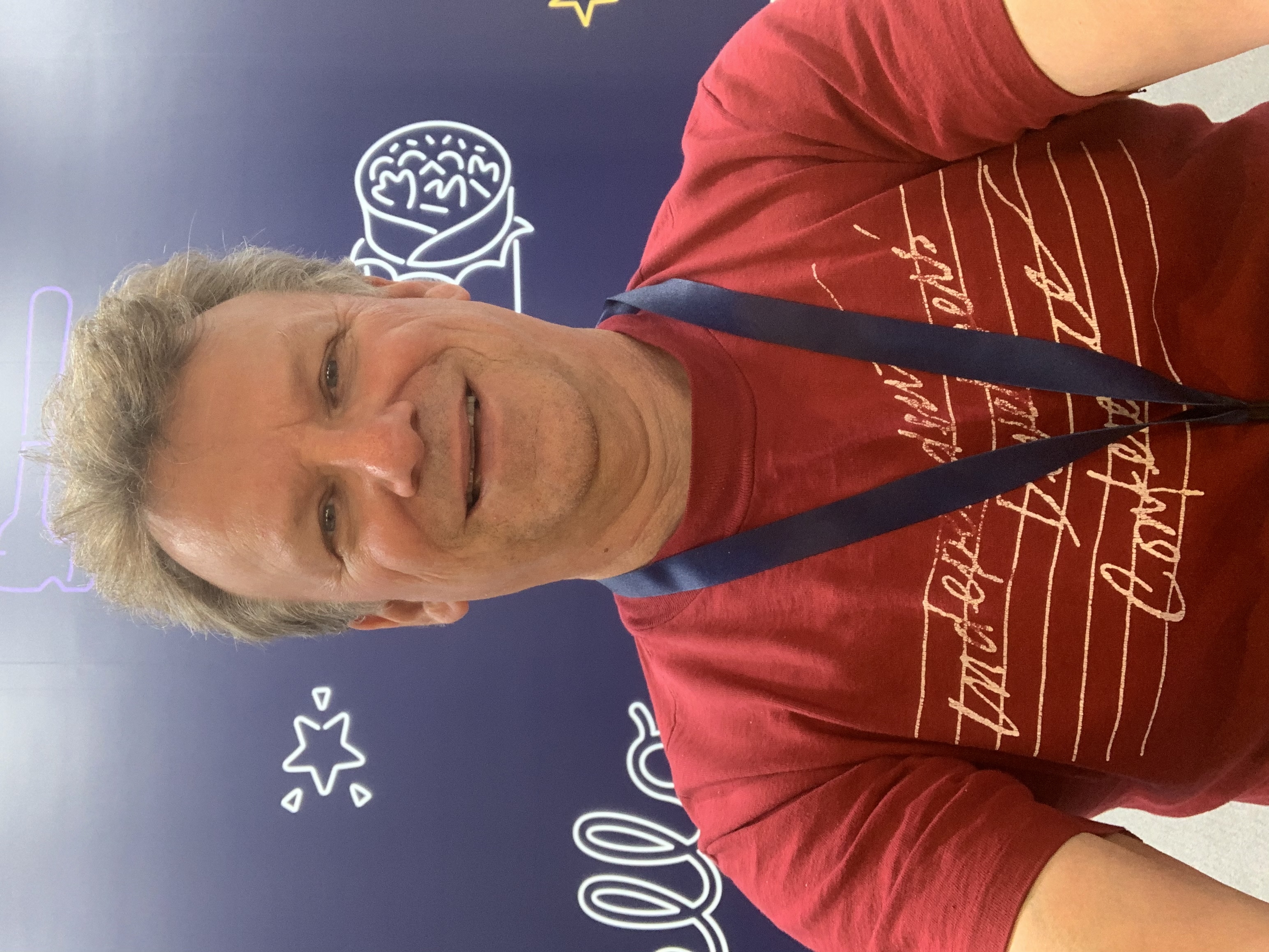 Chris Espinosa wearing a maroon tee shirt saying Independent Developers Conference