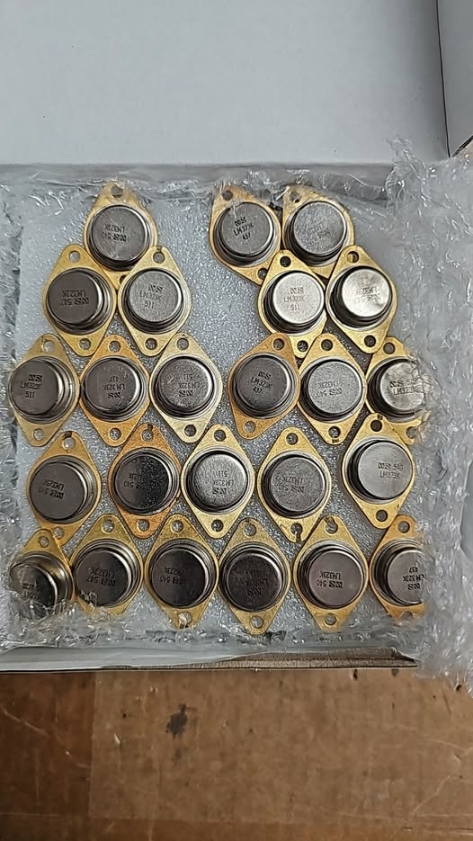 1974 and 1975 LM323K 5V voltage regulators in TO-3 metal can packages with gold-base construction for Apple-1 and early microcomputer power supply restoration.