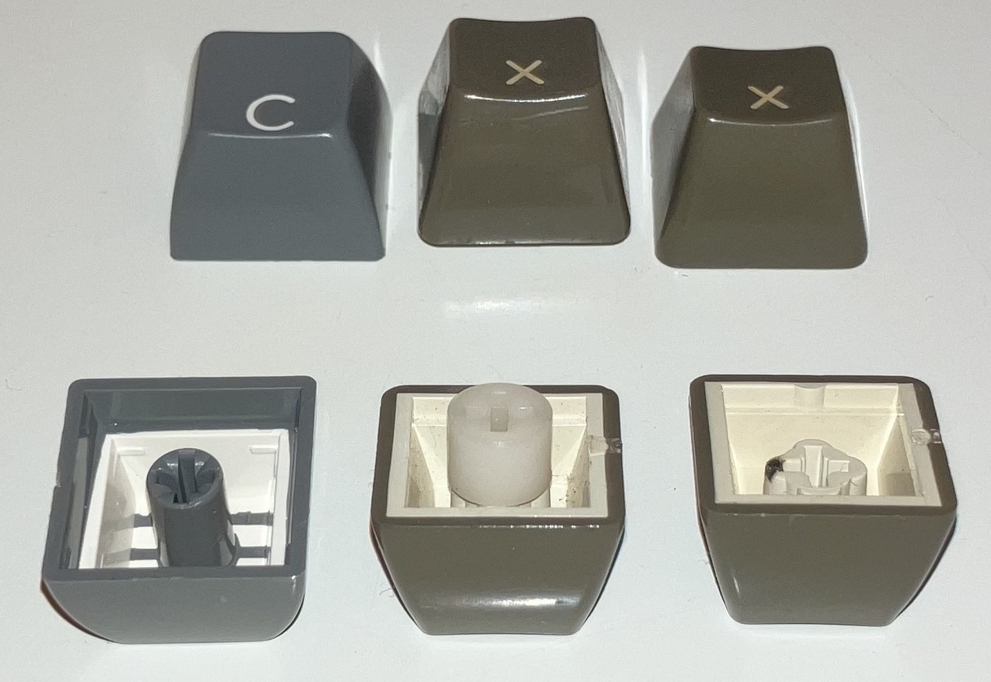 New keycap beside old keycaps.