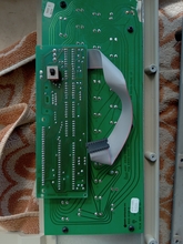 A photo of the underside of an Apple II+ keyboard, showing a switch soldered to it.